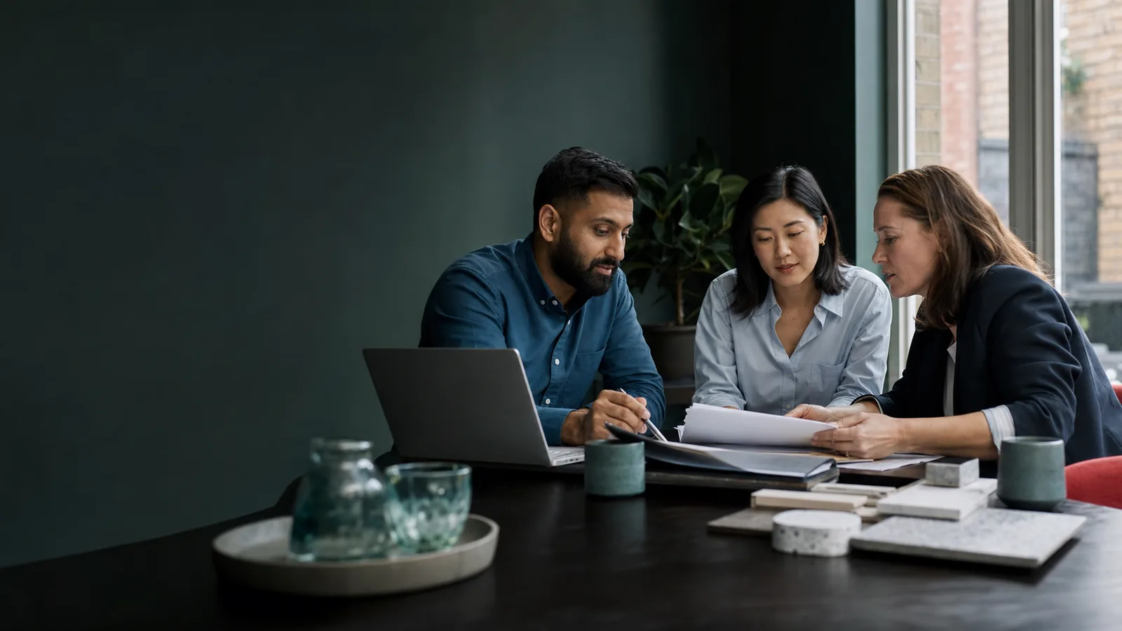 Business owners reviewing a transaction with an adviser